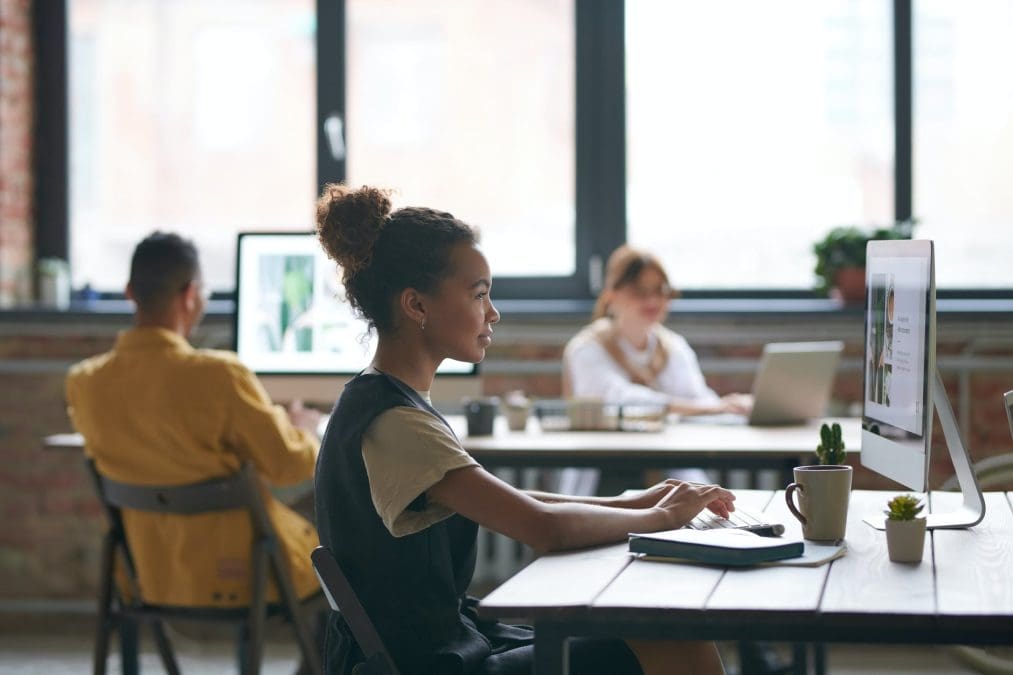 photo of woman using computer