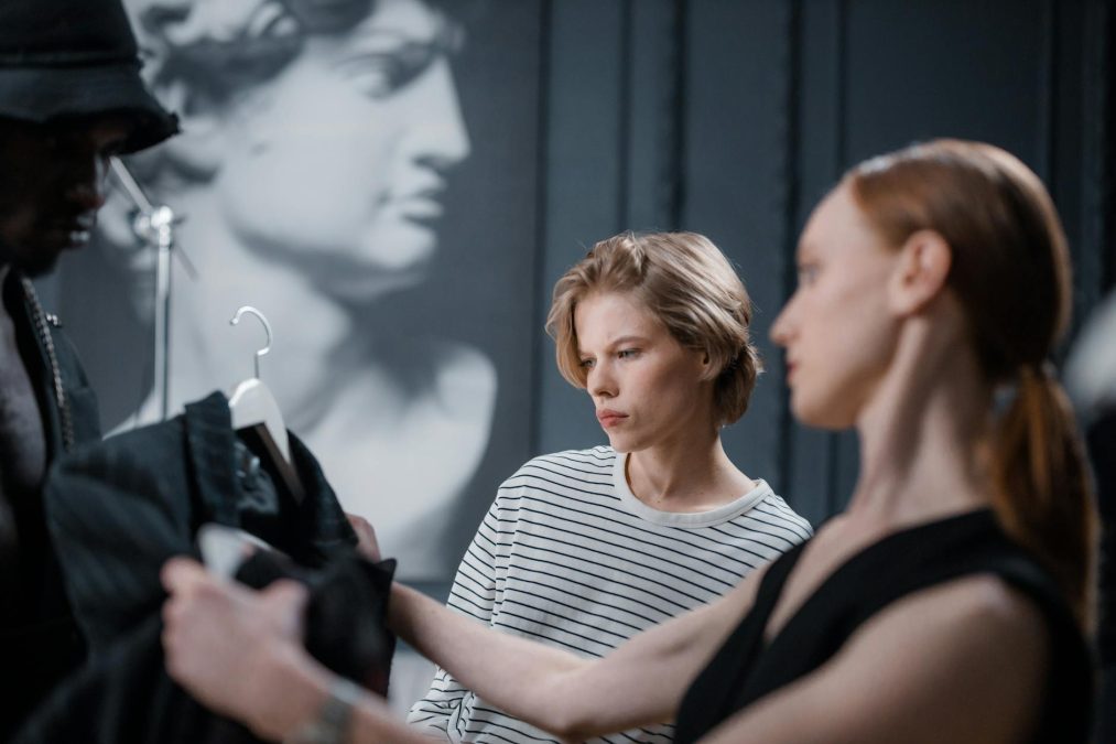 woman holding up a jacket